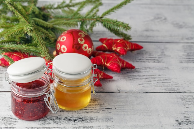 Christmas decoration with berries jam and honey