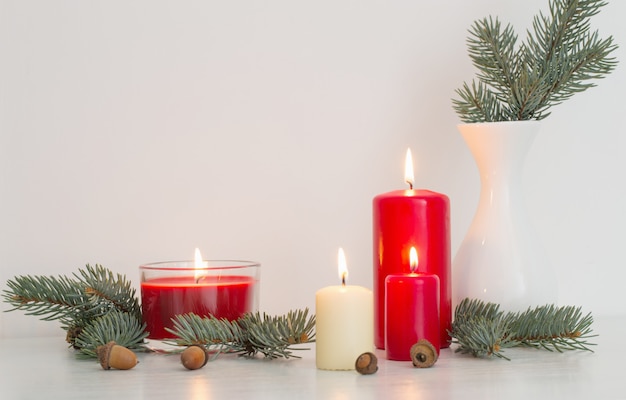 Christmas decoration with candles on white background