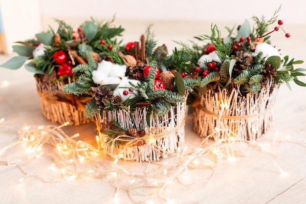 Christmas decoration with carnations, chrysanthemums santini, brunia and fir. Christmas spirit and mood