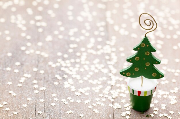 Christmas decoration with fir branches on the wood background.