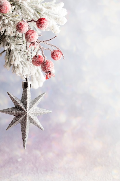 Christmas decoration with fir branches on the wood background.