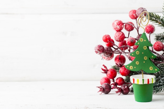 Christmas decoration with fir branches on the wood background