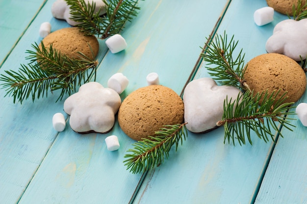 Christmas decoration with fir tree, Christmas cookies and marshmallow.