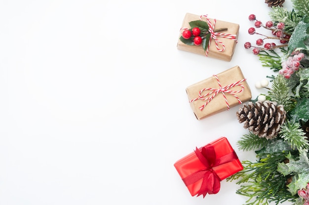 Christmas decoration with gift boxes, fir branches, pine cones.