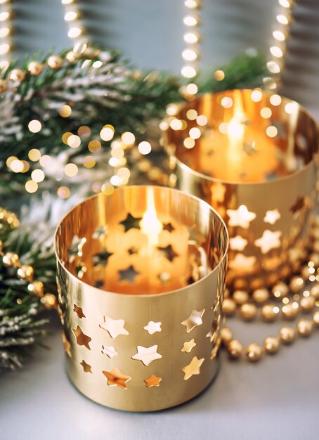 Premium Photo | Christmas decoration with golden lanterns and lights