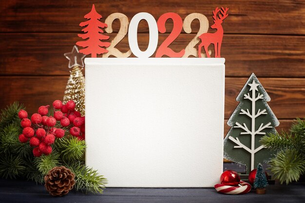 Photo christmas decoration with ornament and defocused lights , christmas card with fir and decor on glitter background