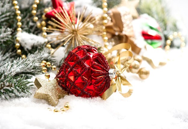 Christmas decoration with red baubles und stars on white background