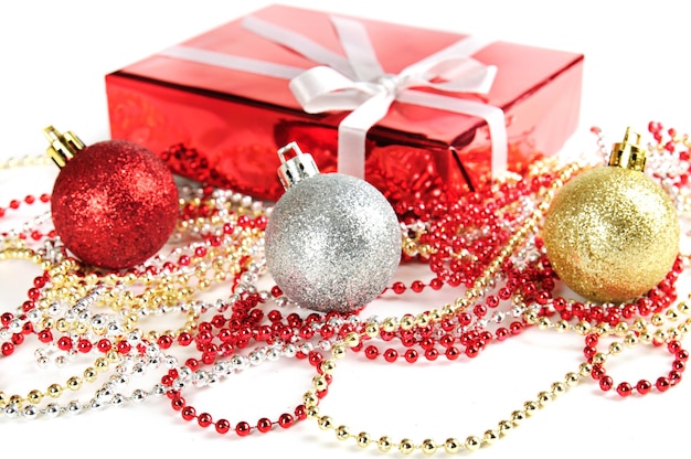 Christmas decoration with red gift box and shiny tinsel