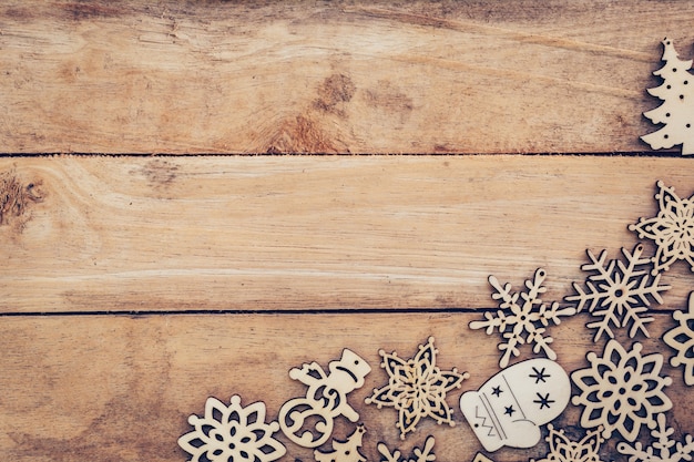 Christmas decoration with wood snowflake on table with copy space