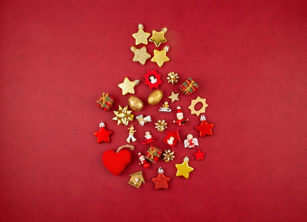 Christmas decoration with xmas golden ornaments with copy space over the red background