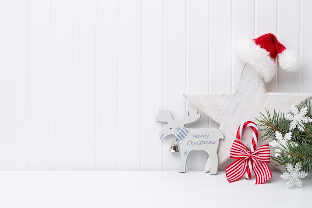 Christmas decoration on a withe wooden background.