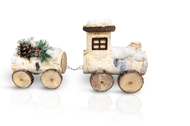 Christmas decoration Wooden steam locomotive with a wagon Isolated on a white background