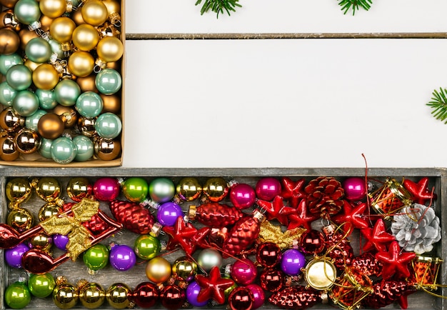 Christmas decorations on a background of white wooden boards 