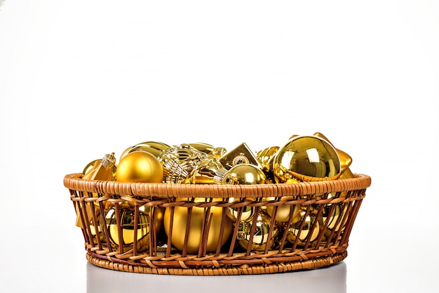 Christmas decorations in basket isolated on white