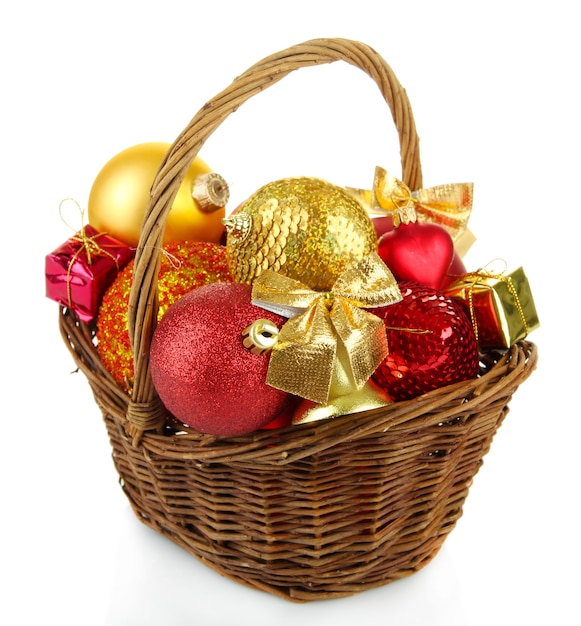 Christmas decorations in basket isolated on white