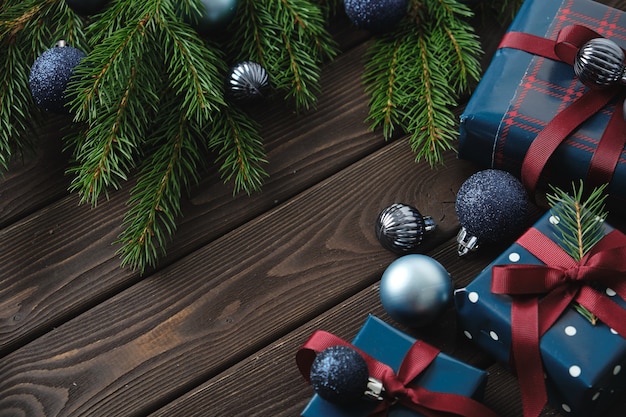 Christmas decorations and Christmas gifts on an old wooden table. Christmas background. 