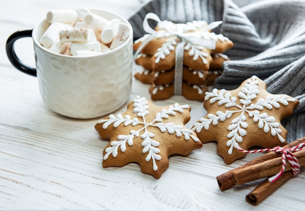 Christmas decorations,  cocoa and gingerbread cookies. White wooden background.