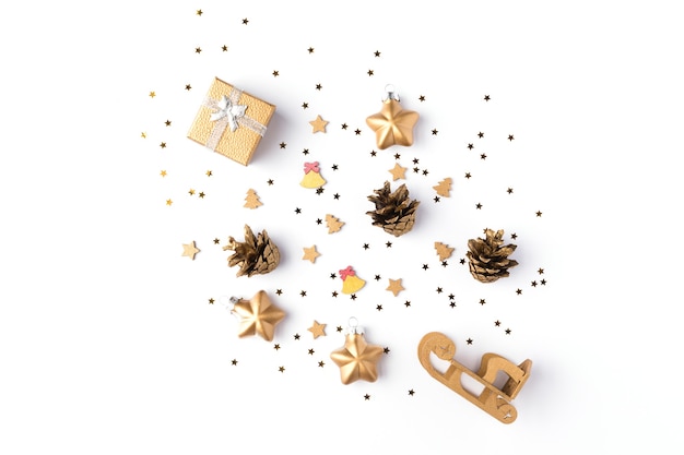 Christmas decorations collection with gold stars, pine cones and gift for mock up isolated on white background. Top view. Flat lay