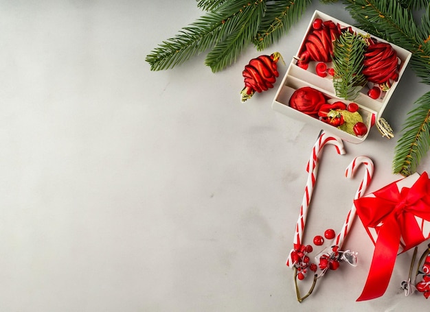 Christmas decorations concept Top view photo of gold and green baubles balls star ornaments confetti and pine branches on isolated white background with empty space