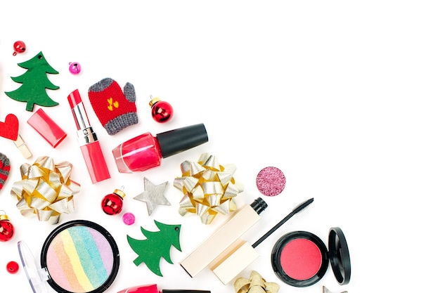 Christmas  decorations and cosmetic products on white background. Holiday and celebration creative concept. Flat lay, top view