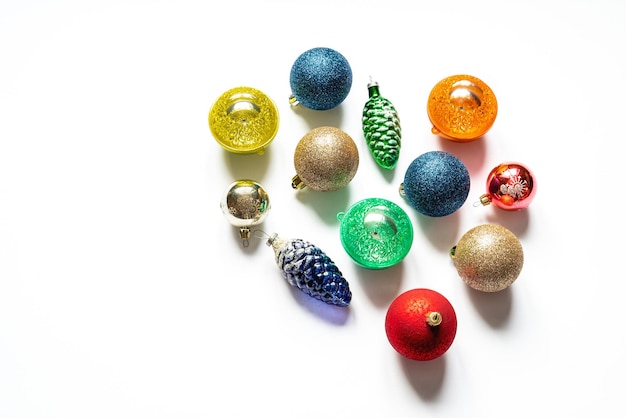 Photo christmas decorations of different shapes and colors on a white background