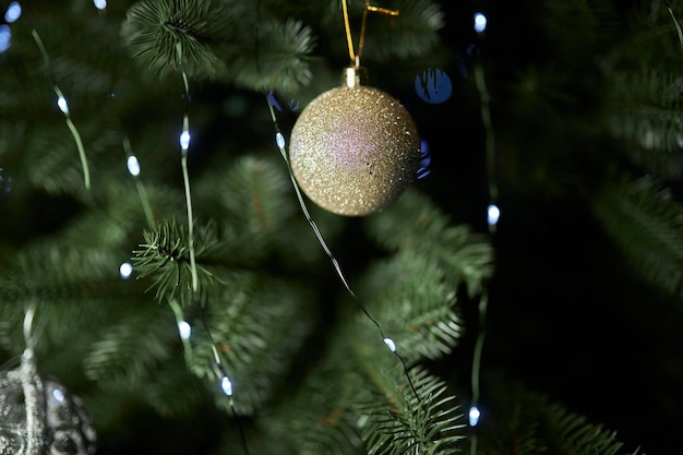 Christmas decorations on a festive tree. Festive traditional background for the New Year.