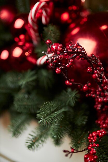 Christmas decorations on a festive tree. Festive traditional background for the New Year.