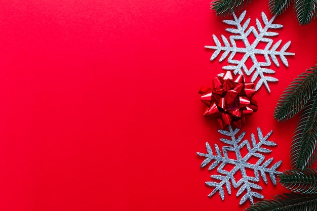 Christmas decorations, fir tree branches on red