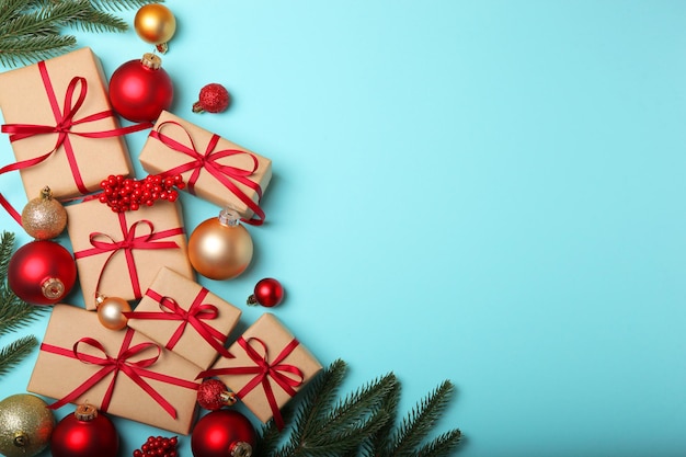 Christmas decorations and gifts on a colored background top view