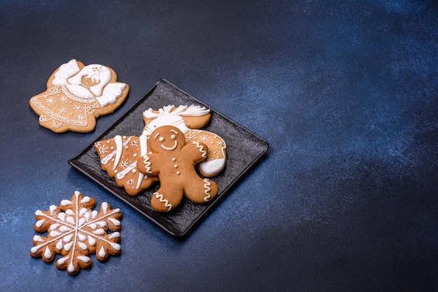 Christmas decorations and gingerbreads on a dark concrete table Getting ready to celebration