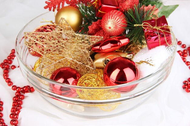 Christmas decorations in glass vase close up