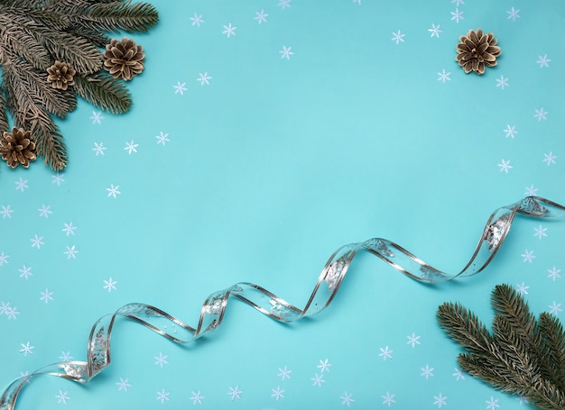 Christmas decorations on light blue background. Flat lay. New year concept.