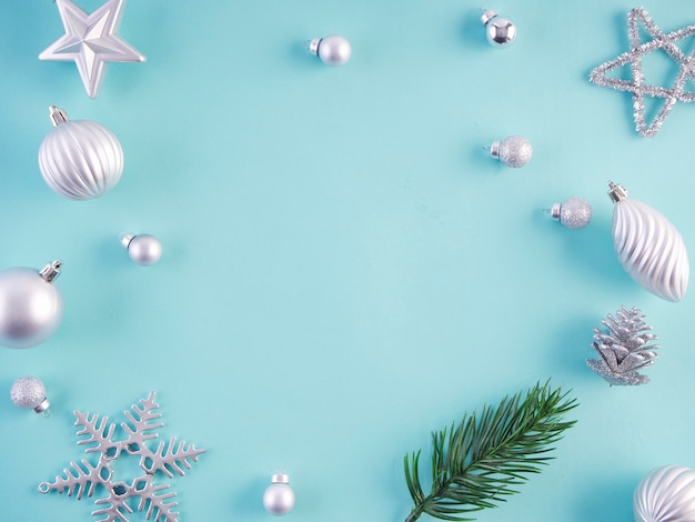 Christmas decorations on light blue surface