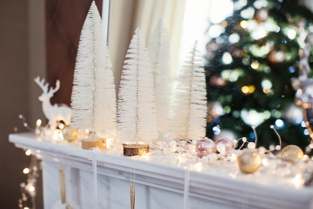 Christmas decorations and lights on fireplace