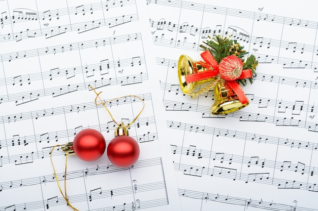 Christmas decorations lying on notes sheet