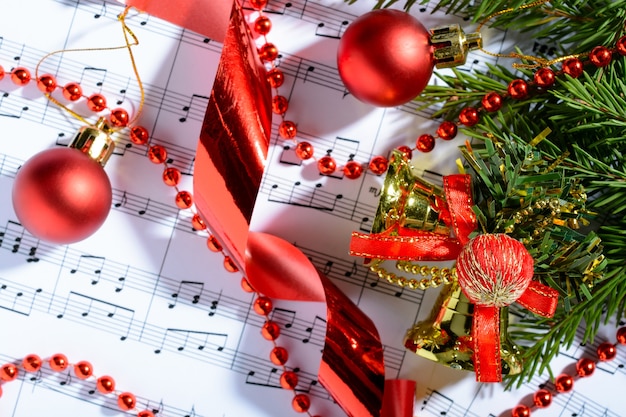 Christmas decorations lying on notes sheet