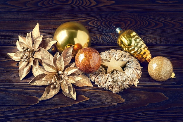 Christmas decorations New Year's decorations on a dark wooden background Garlands balls stars