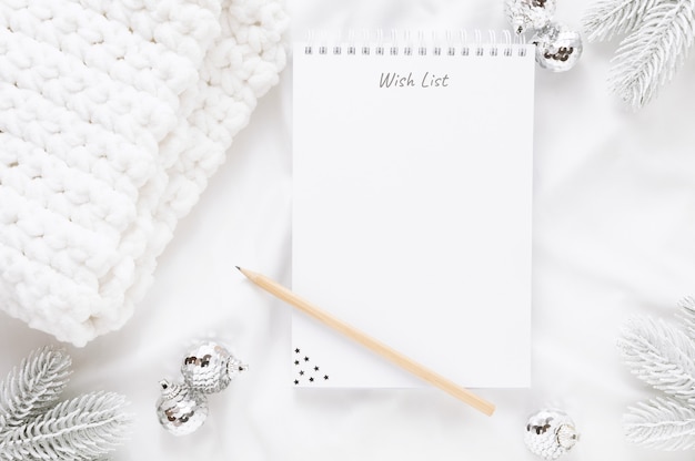 Christmas decorations and a notepad with a wish list