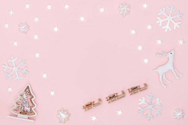 Christmas decorations on pink background