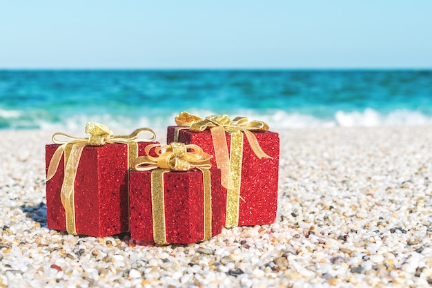 Christmas decorations in the sand on a beach