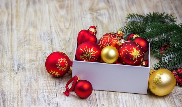 Christmas decorations toys gifts on a wooden background.