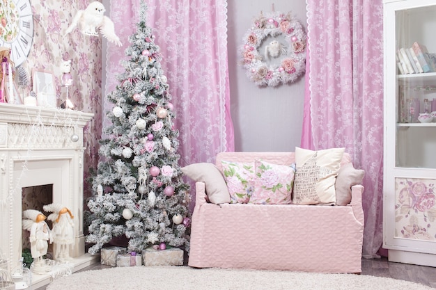 Christmas decorations and tree for background. pink shades.