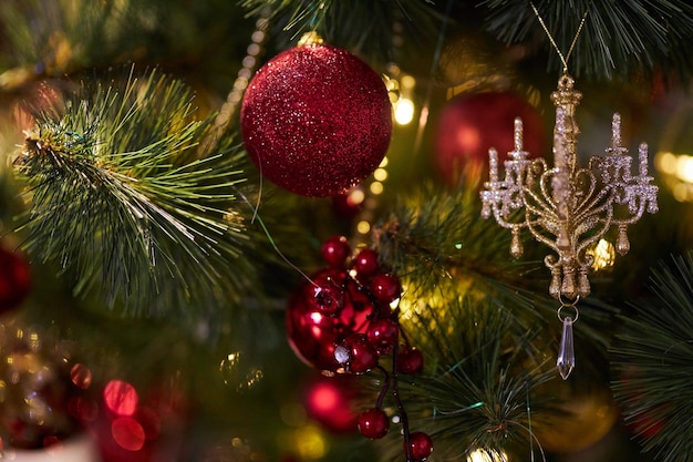 Christmas decorations on the tree Red balls garlands and other decorations on the Christmas tree