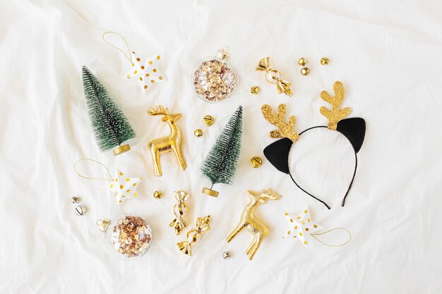 Christmas decorations  on white bed. Holiday concept. Flat lay, top view