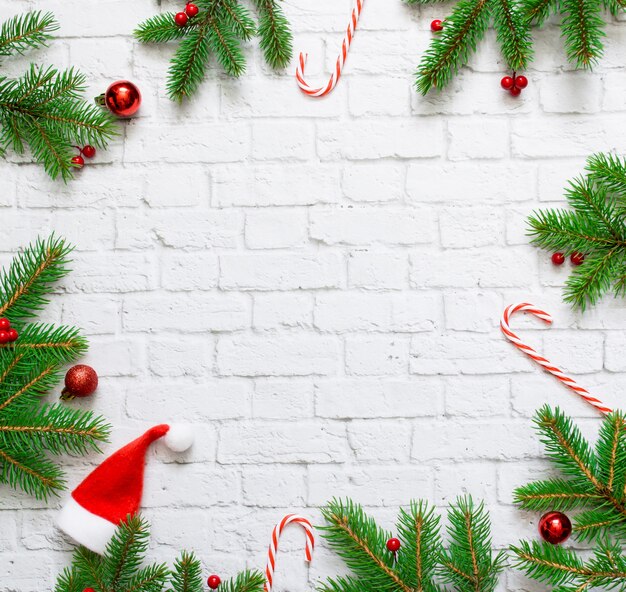 Christmas decorations on white brick wall