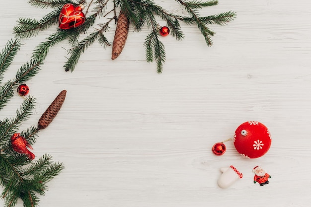 Christmas decorations on a white wooden table with copy space