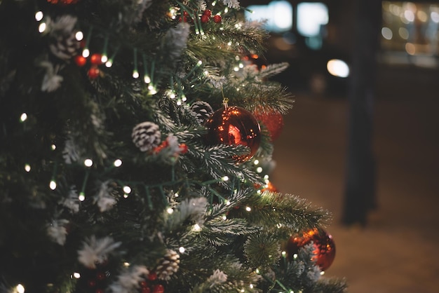 Christmas decorations with Christmas balls, colorful lights, and spruce branches