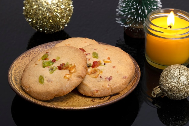 Christmas decorations with a plate of orange peel cookies.