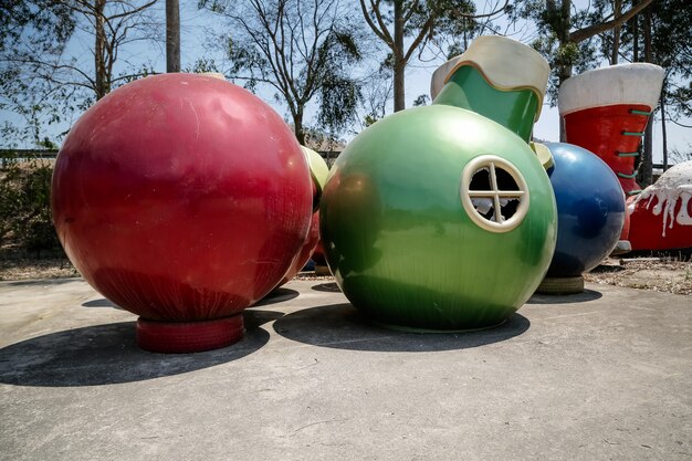 Christmas decorations with Santa Claus and colored balls in the garden