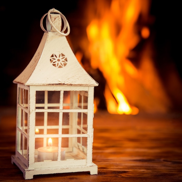 Christmas decorations on wood table near fireplace.  Winter holiday concept